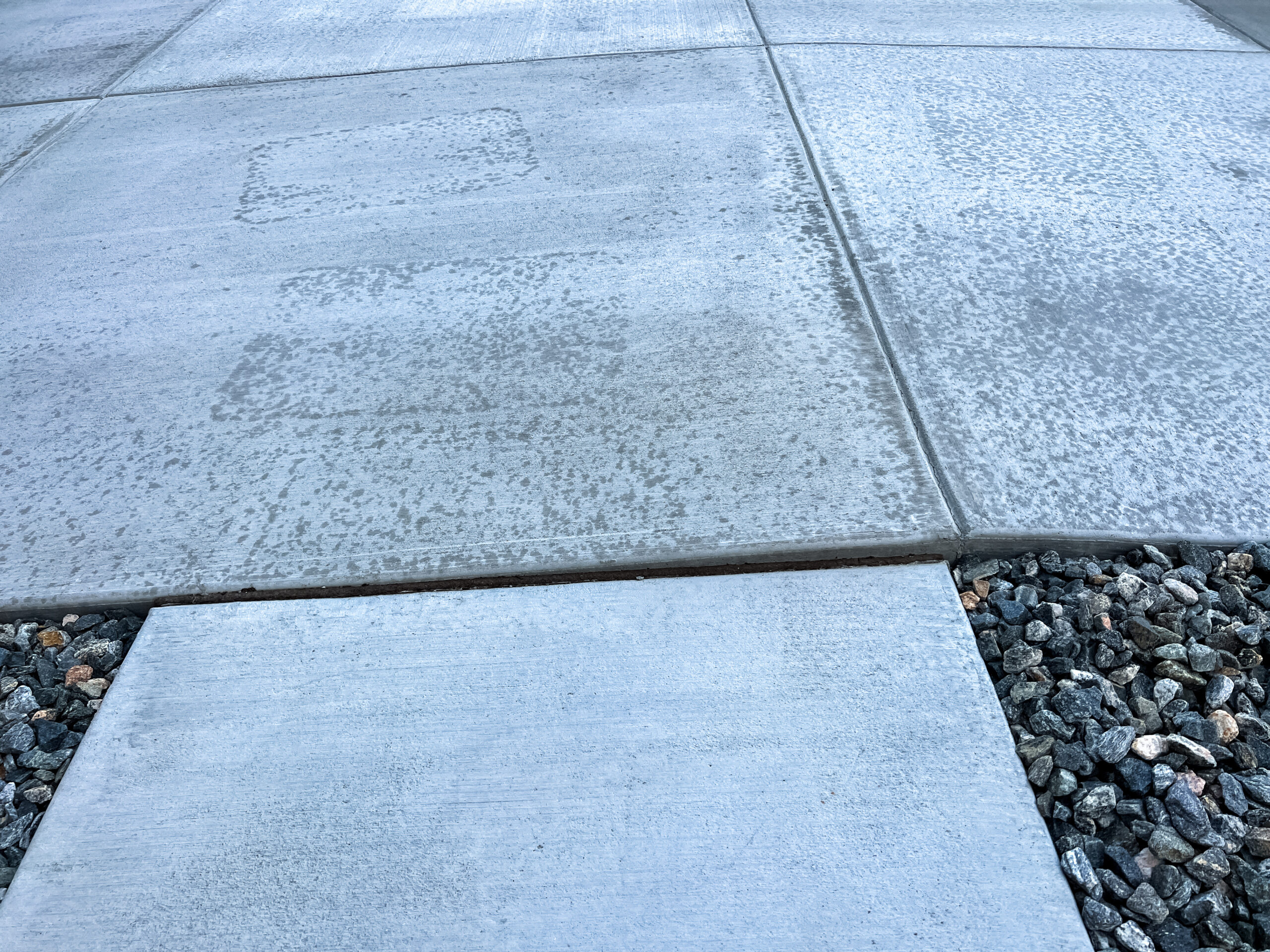 Uneven concrete slabs creating a trip hazard