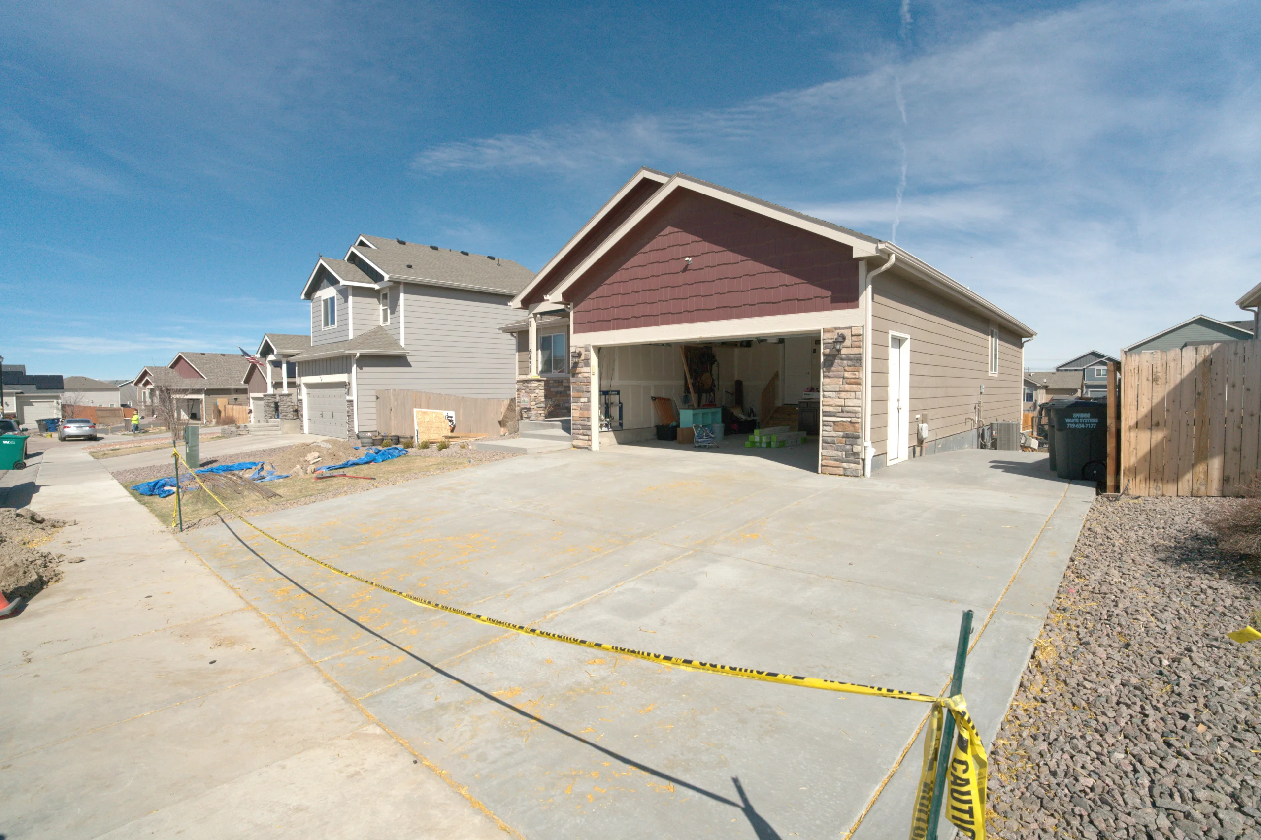 New concrete driveway installation at residential home in Colorado Springs CO by Fort August Construction.