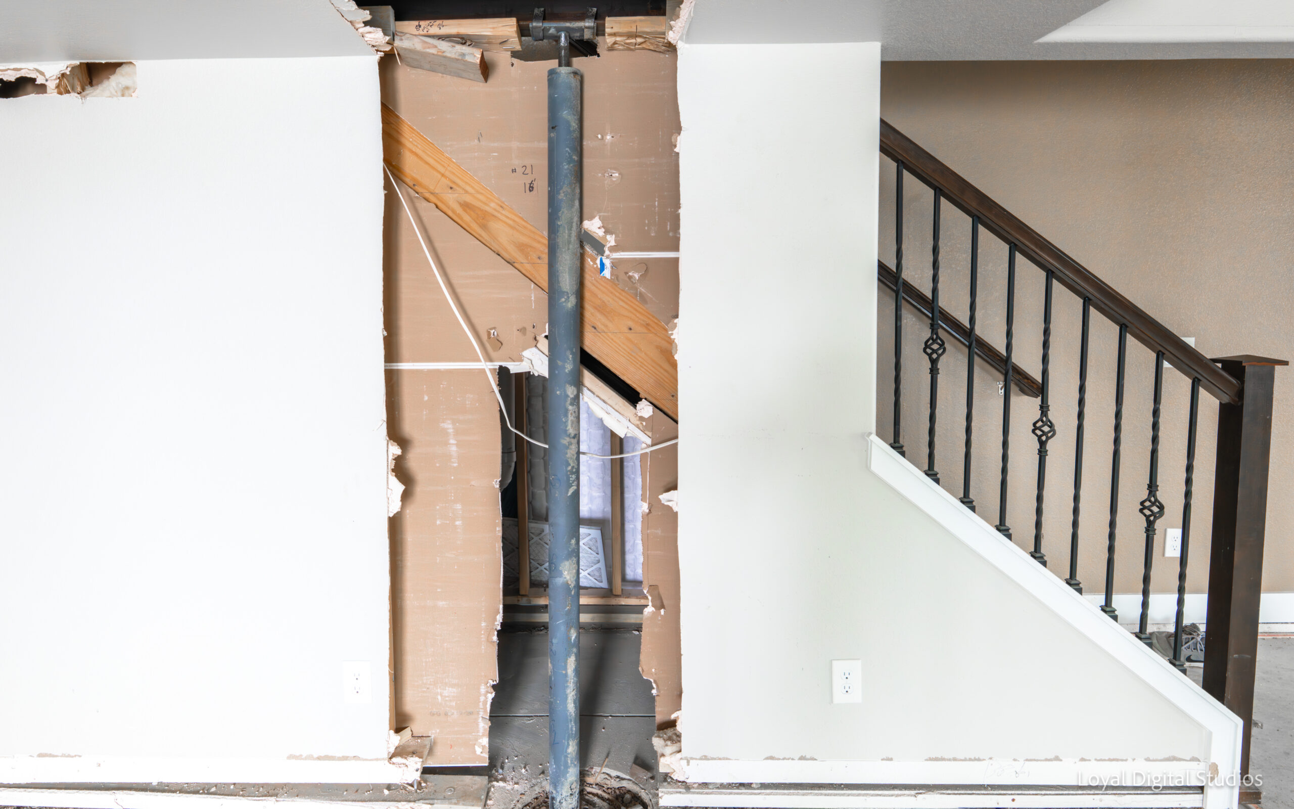 Interior structural pier installation for residential foundation stabilization in Colorado.