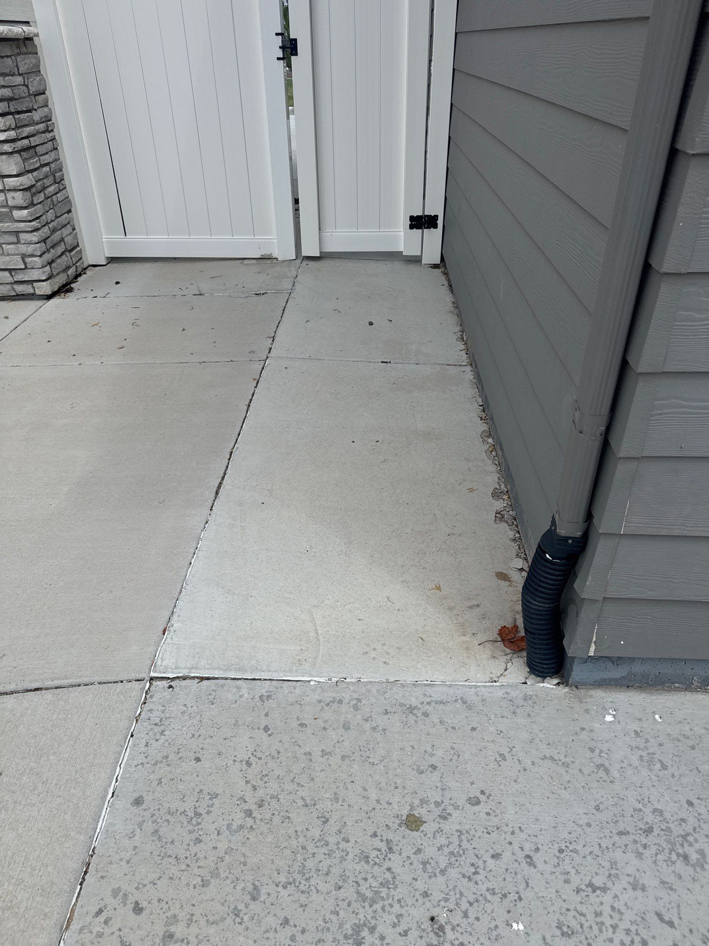 Exterior concrete separation near foundation in Brighton Colorado inspected by Fort August Foundation for settlement and structural movement issues