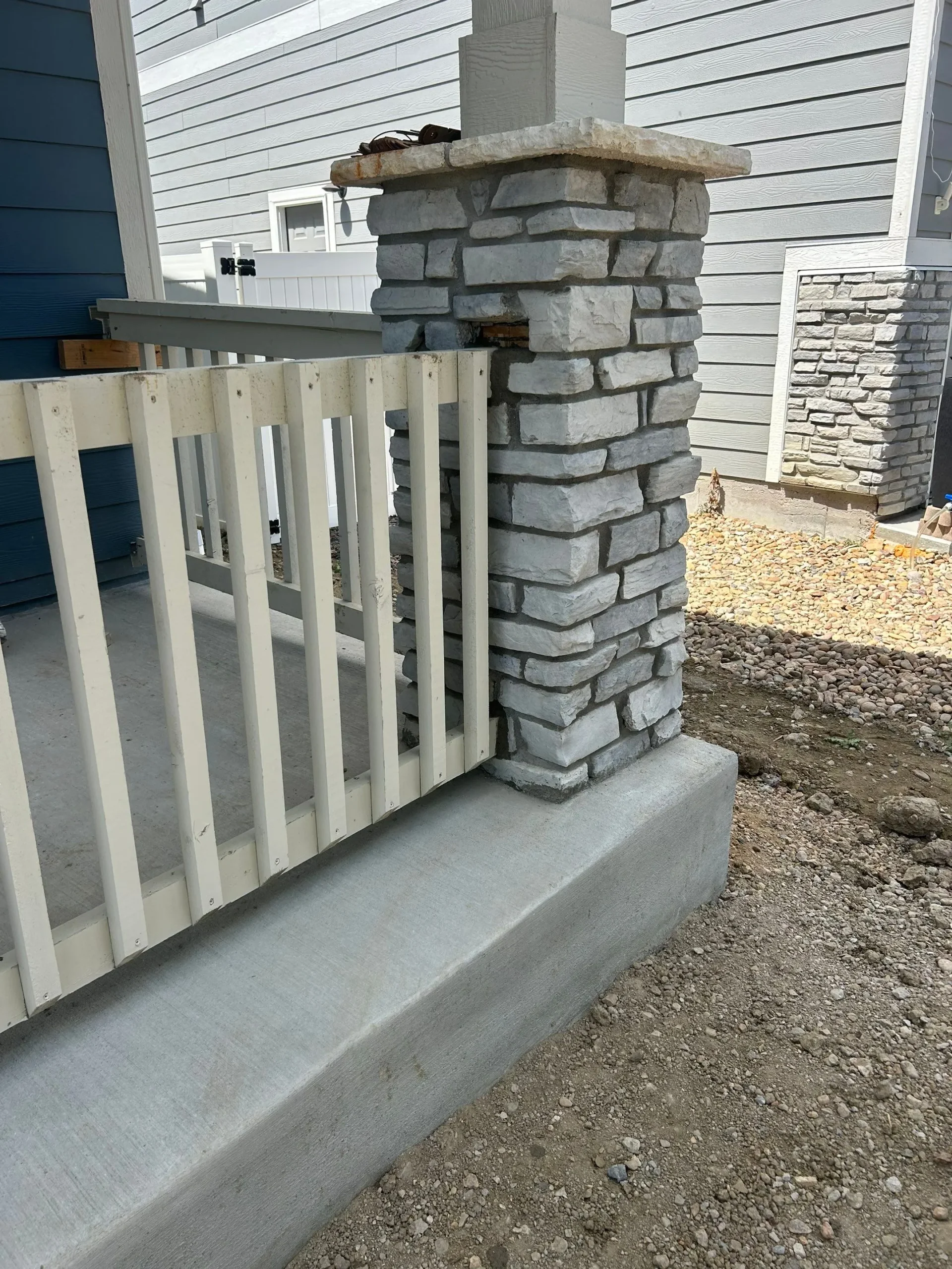Porch railing stabilization in Berthoud Colorado by Fort August Foundation improving structural support and safety for the home's entryway.