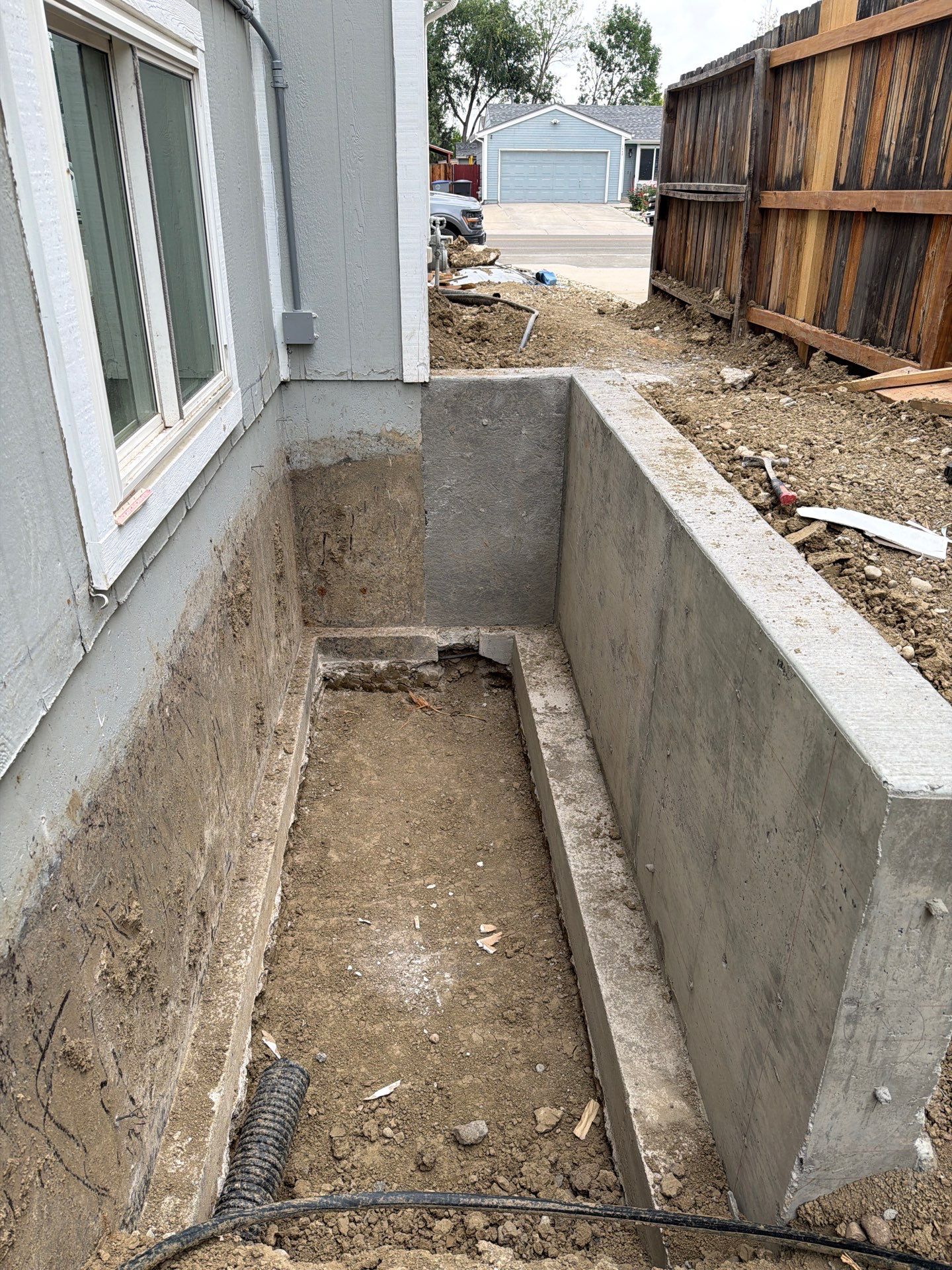 Crew Preping the area for a new Egress door to be installed.