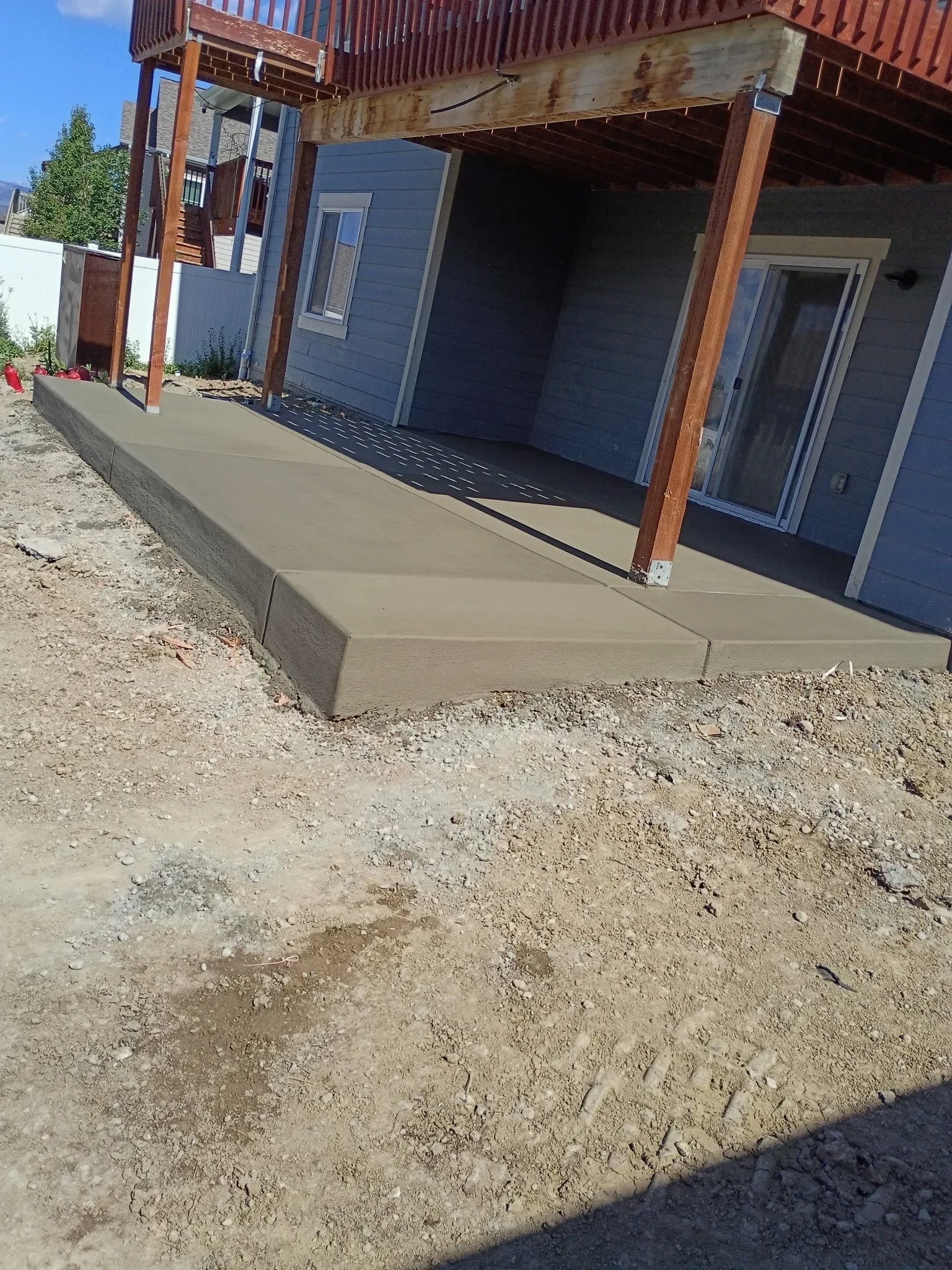 New concrete patio installation in Berthoud Colorado by Fort August Foundation featuring professional concrete work, proper site preparation, and long-lasting outdoor living construction.